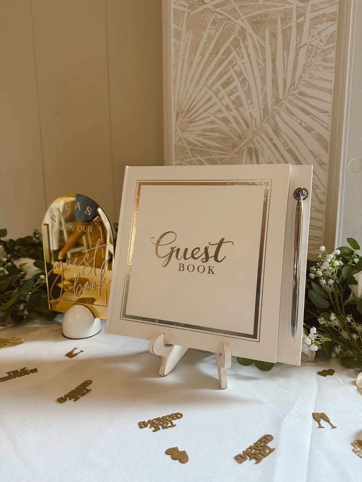 Guest book table detail with elegant gold and ivory styling for wedding celebrations and romantic events at MeetUps Event Center