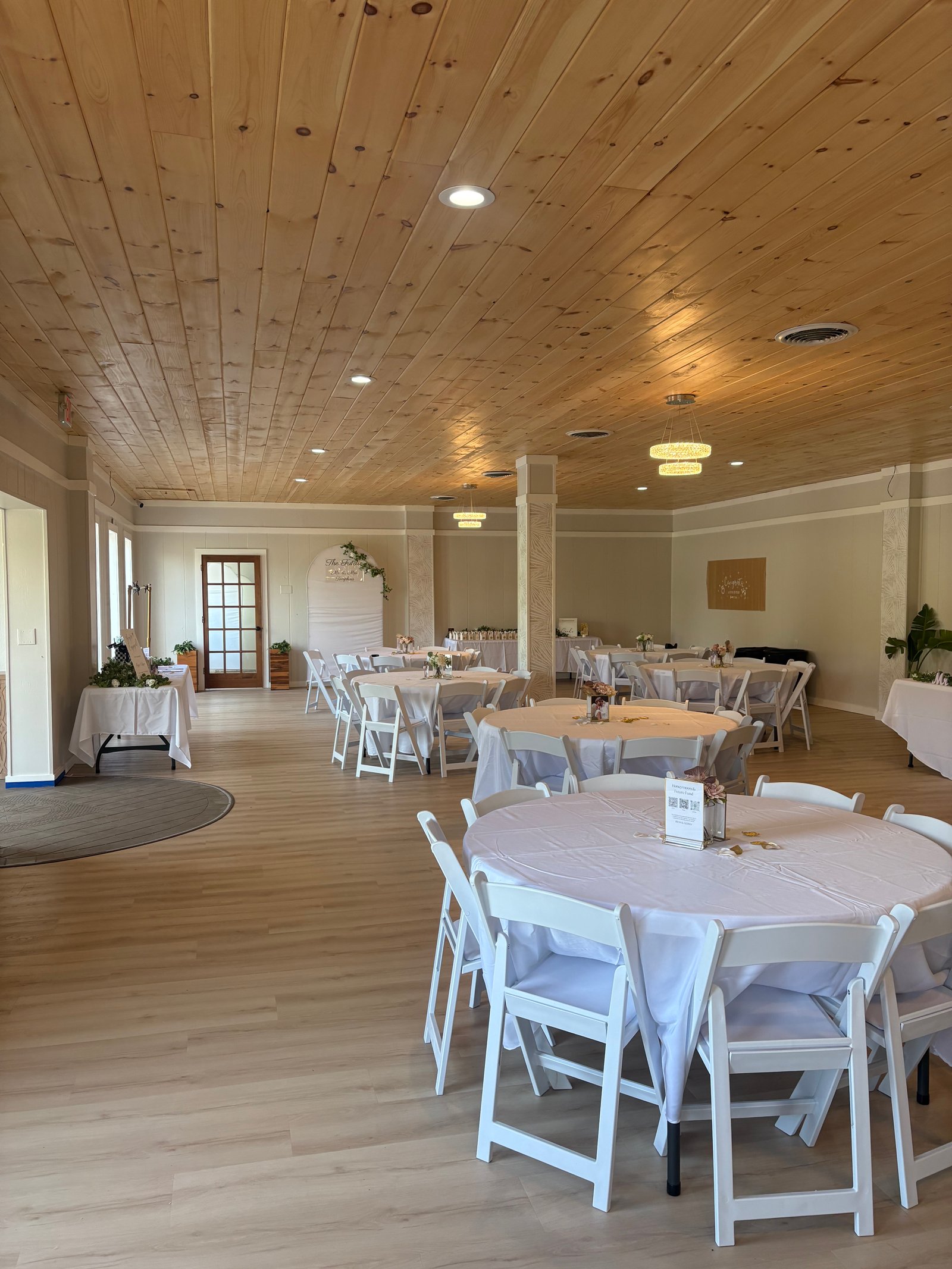 Wide view of MeetUps Event Center arranged with round tables for milestone celebrations, reunions, and special gatherings